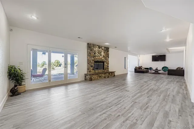 a view of a balcony with wooden floor