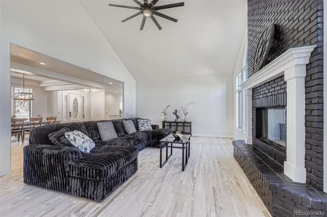 a kitchen with a refrigerator and white cabinets