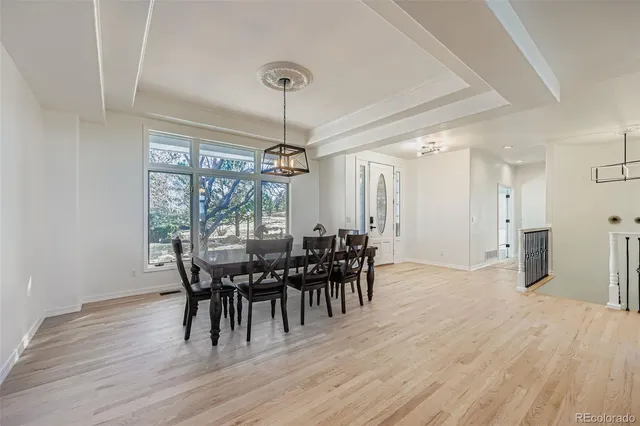 a kitchen with granite countertop a sink stove and cabinets