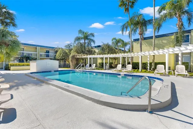 a view of a swimming pool with a patio