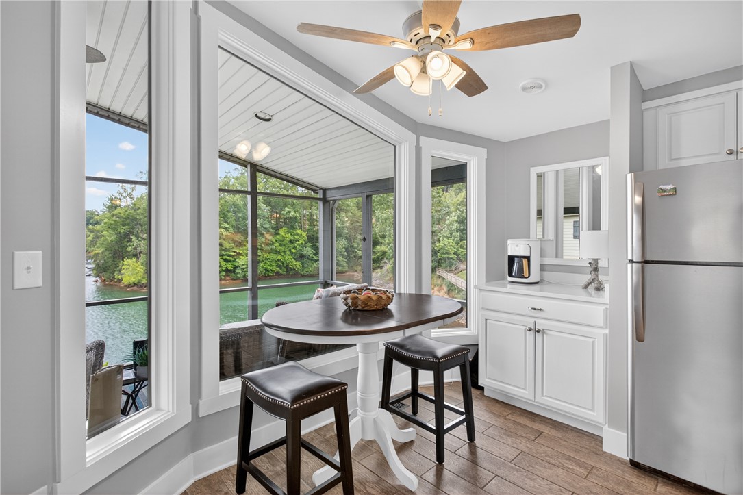 1230 Melton Road, Unit 4 West Union, SC 29696 - Photo 31 of 48 Lakeside dining with panoramic views from a charming screened porch.