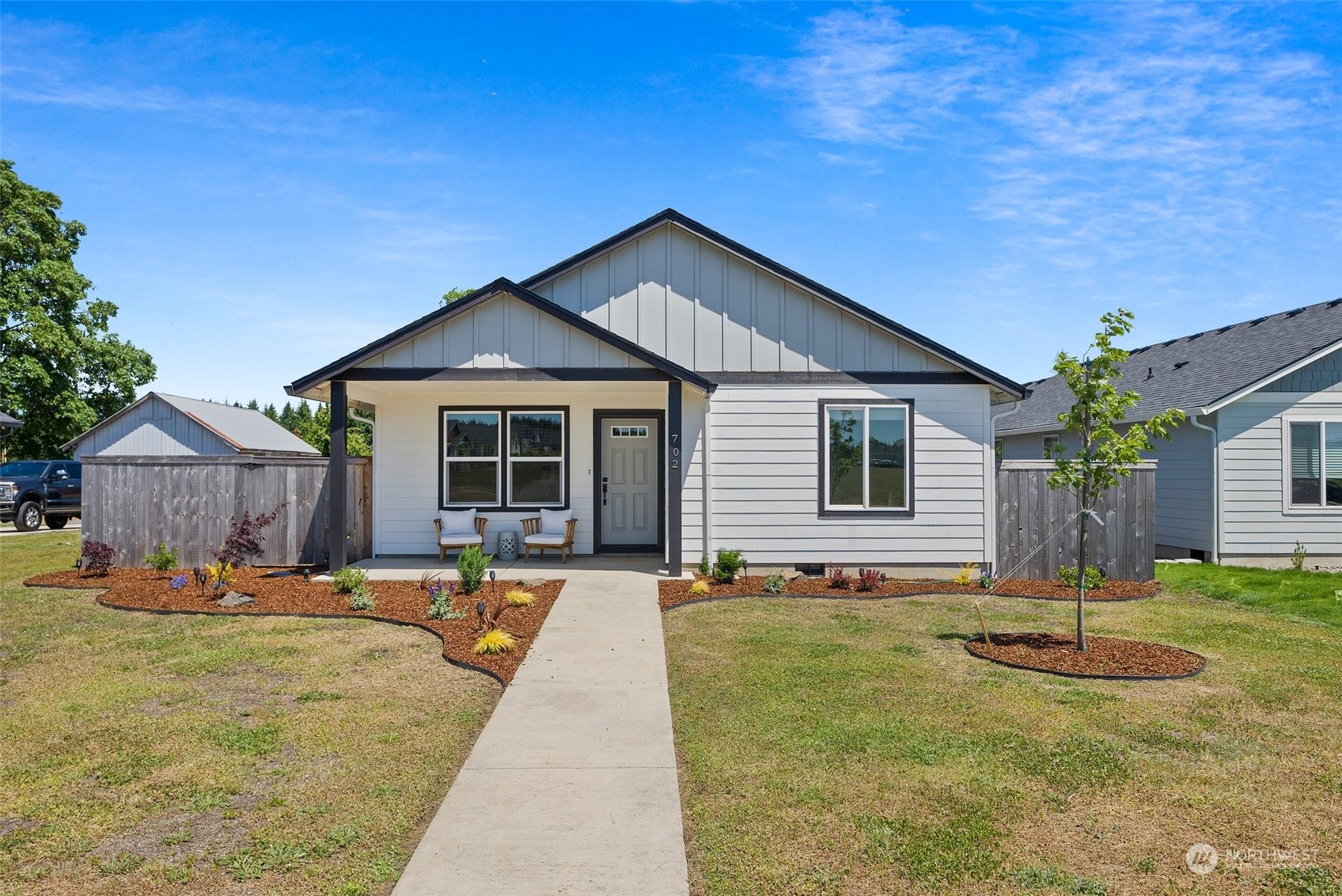 702 Roundtree Boulevard Winlock, WA 98596 - Photo 1 of 35 a front view of a house with a yard