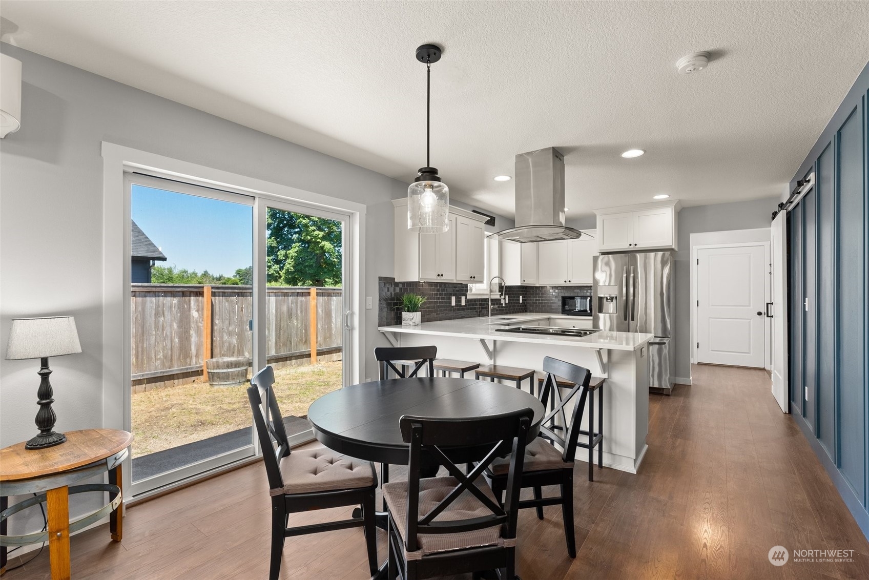 702 Roundtree Boulevard Winlock, WA 98596 - Photo 12 of 35 a view of a dining room with furniture window and wooden floor