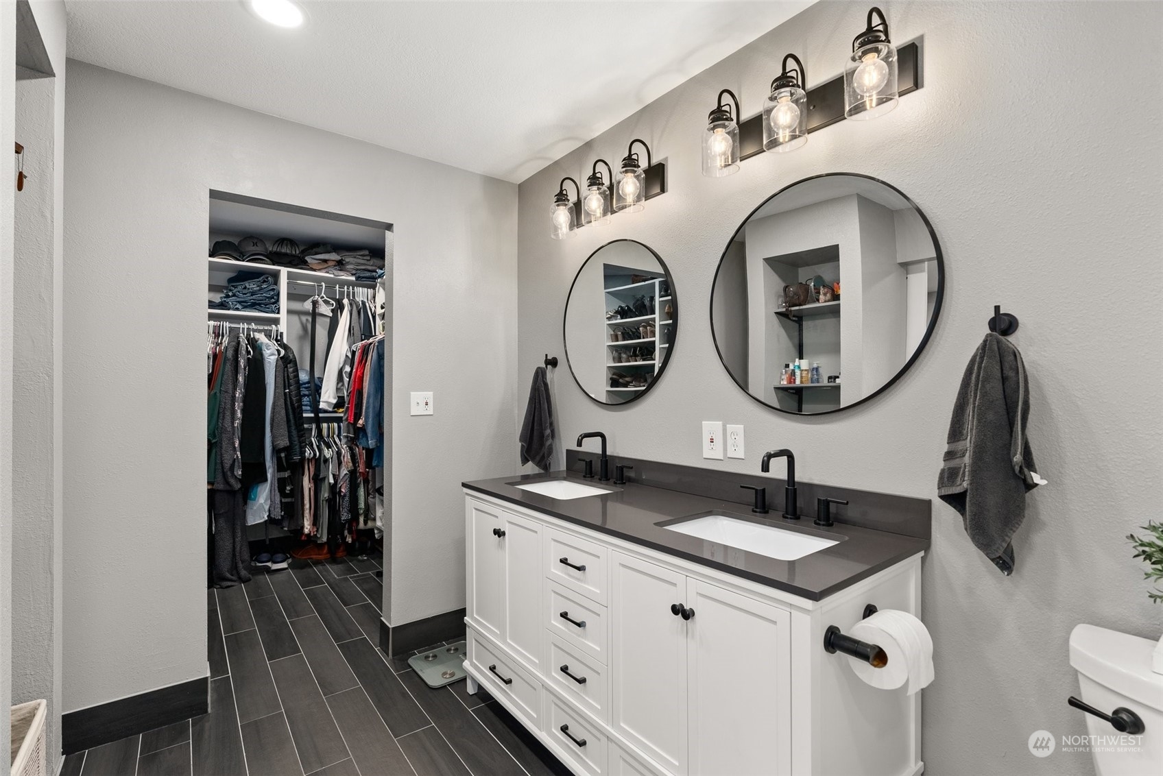 702 Roundtree Boulevard Winlock, WA 98596 - Photo 17 of 35 a bathroom with a double vanity sink and a mirror