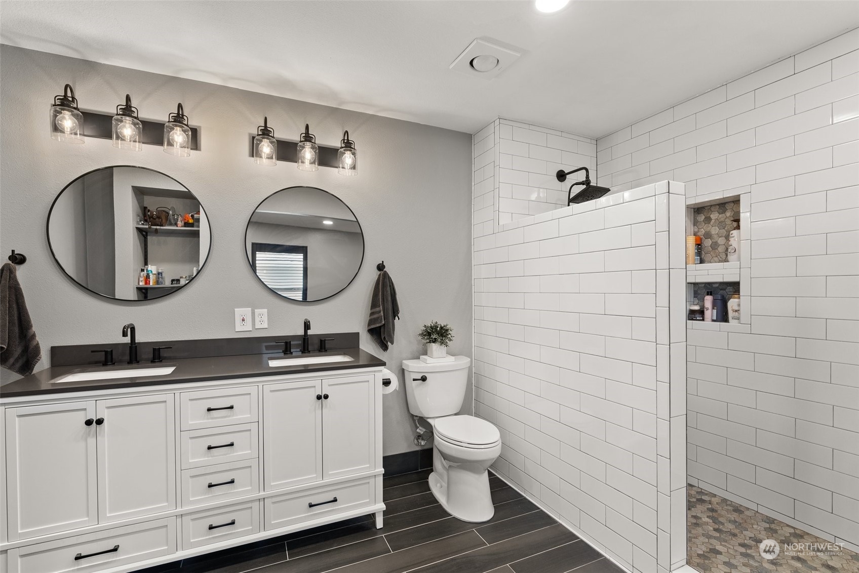 702 Roundtree Boulevard Winlock, WA 98596 - Photo 18 of 35 a bathroom with a double vanity sink mirror and toilet