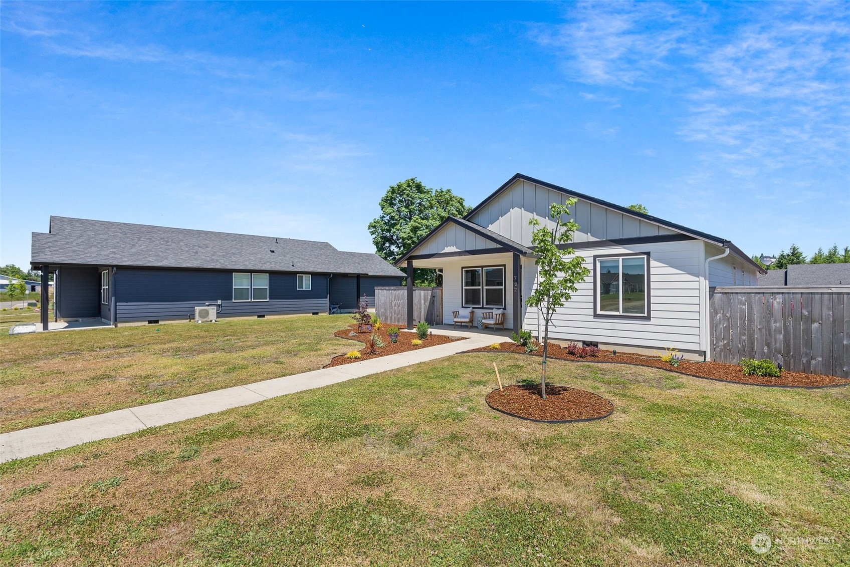 702 Roundtree Boulevard Winlock, WA 98596 - Photo 2 of 35 a view of a house with swimming pool and a yard