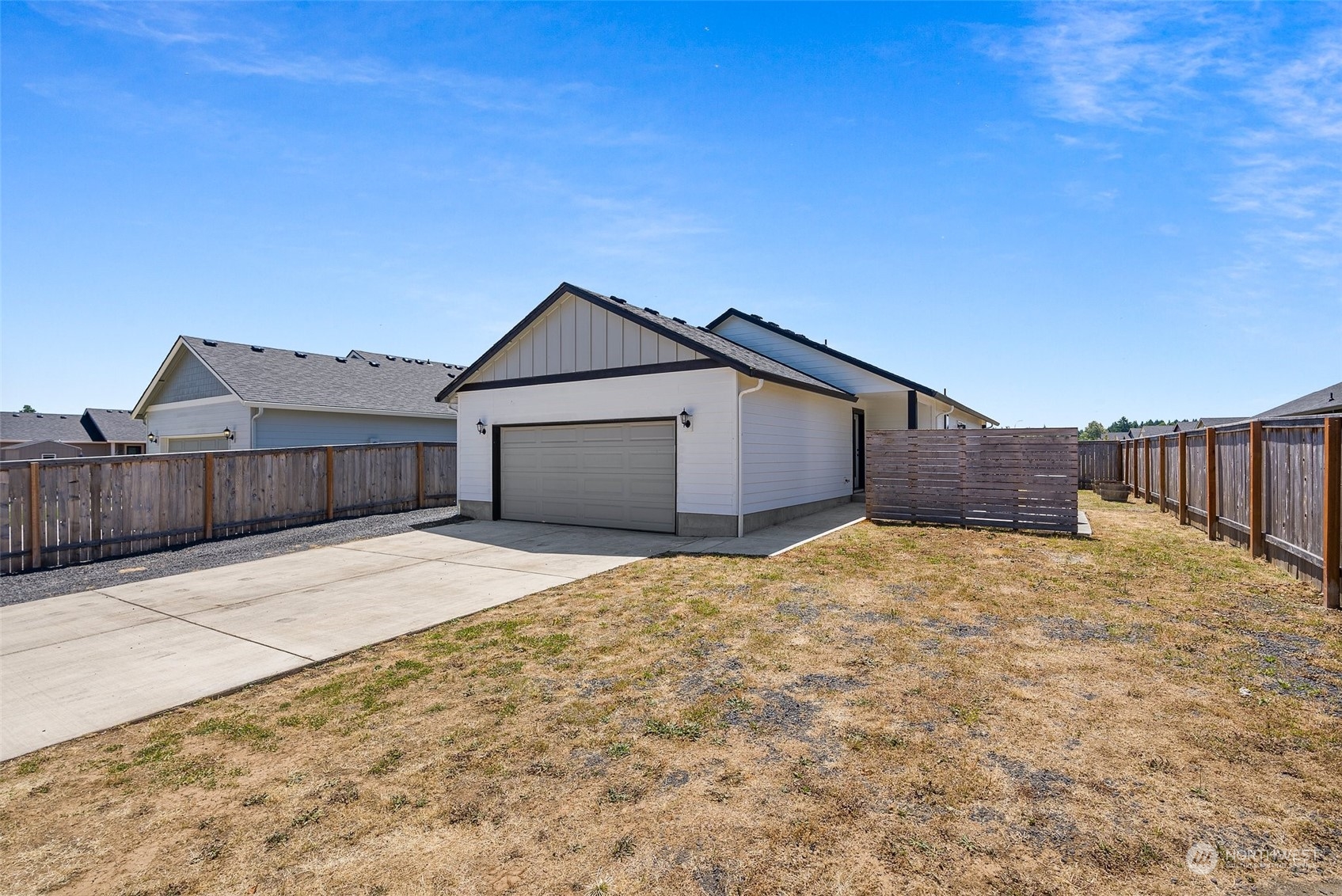 702 Roundtree Boulevard Winlock, WA 98596 - Photo 30 of 35 a house with wooden fence