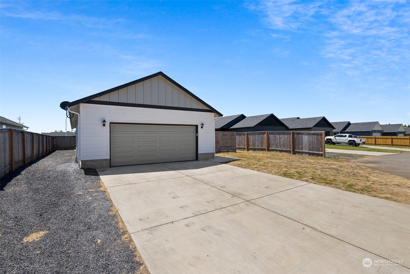 702 Roundtree Boulevard Winlock, WA 98596 - Photo 31 of 35 a front view of a house with a yard and garage
