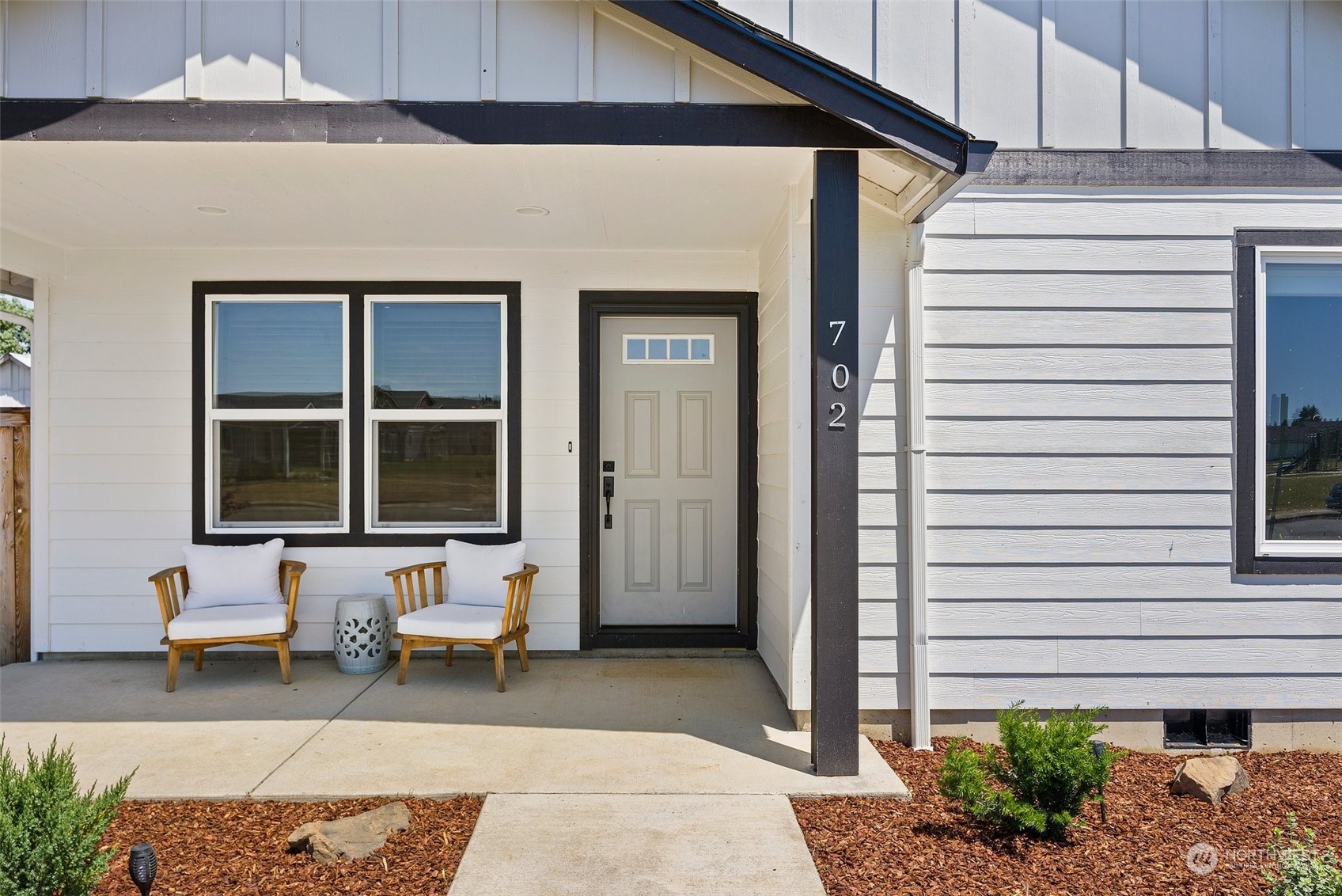 702 Roundtree Boulevard Winlock, WA 98596 - Photo 4 of 35 a balcony with furniture and potted plants