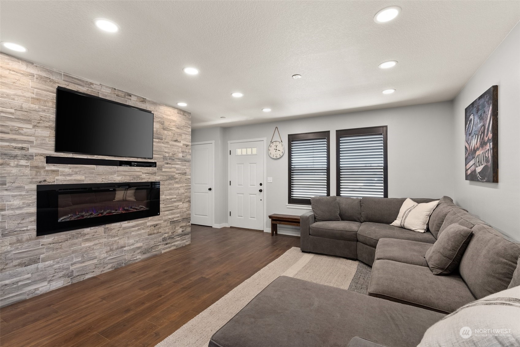 702 Roundtree Boulevard Winlock, WA 98596 - Photo 5 of 35 a living room with furniture a flat screen tv and a fireplace