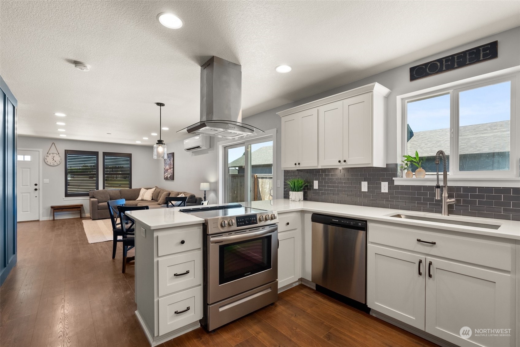 702 Roundtree Boulevard Winlock, WA 98596 - Photo 9 of 35 a kitchen with a stove top oven sink and cabinets