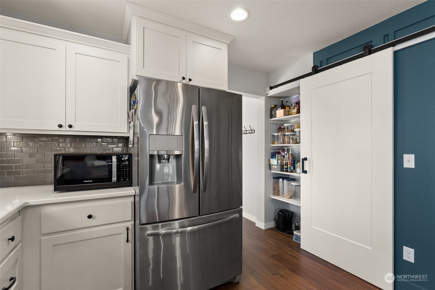 702 Roundtree Boulevard Winlock, WA 98596 - Photo 10 of 35 a kitchen with a refrigerator and a stove top oven