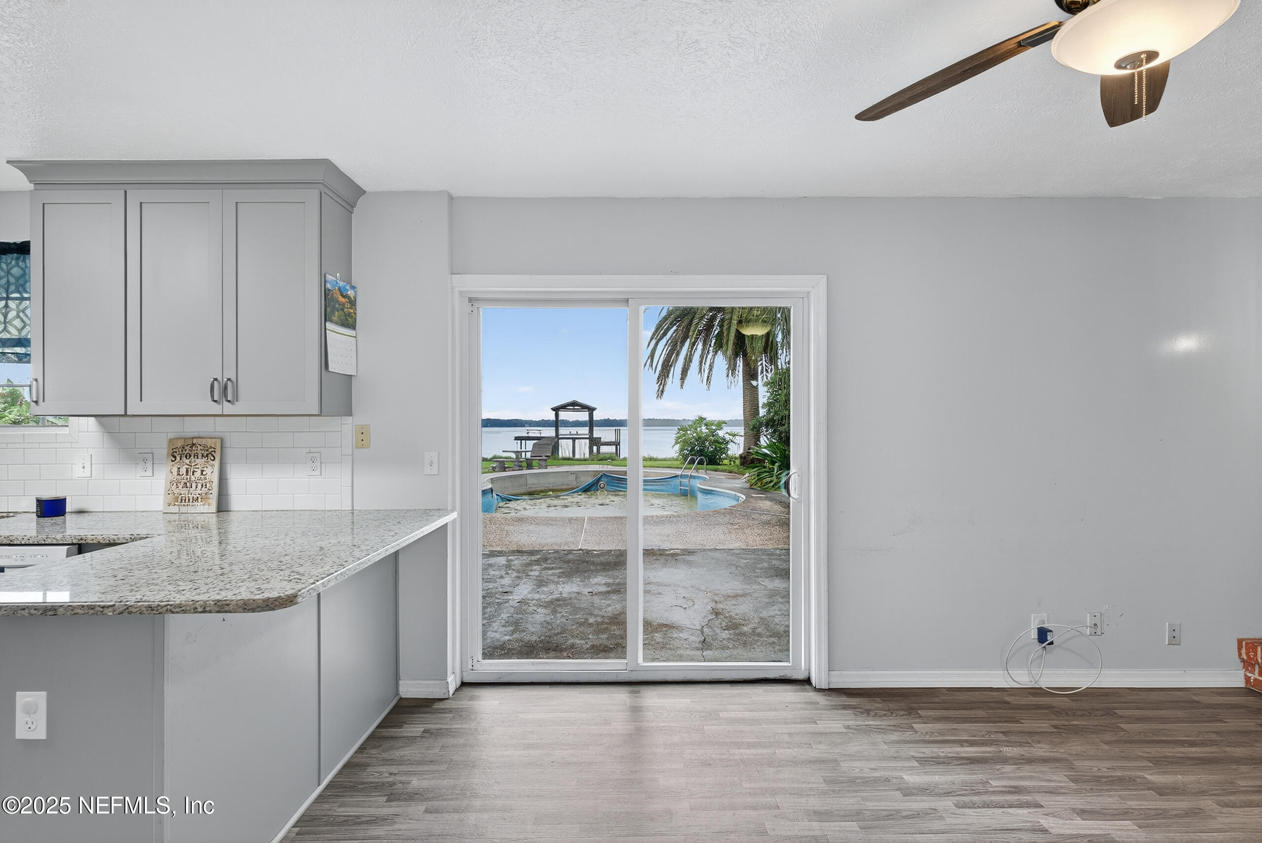 4429 Cedar Road Orange Park, FL 32065 - Photo 12 of 50 a kitchen with granite countertop a sink and a wooden cabinets