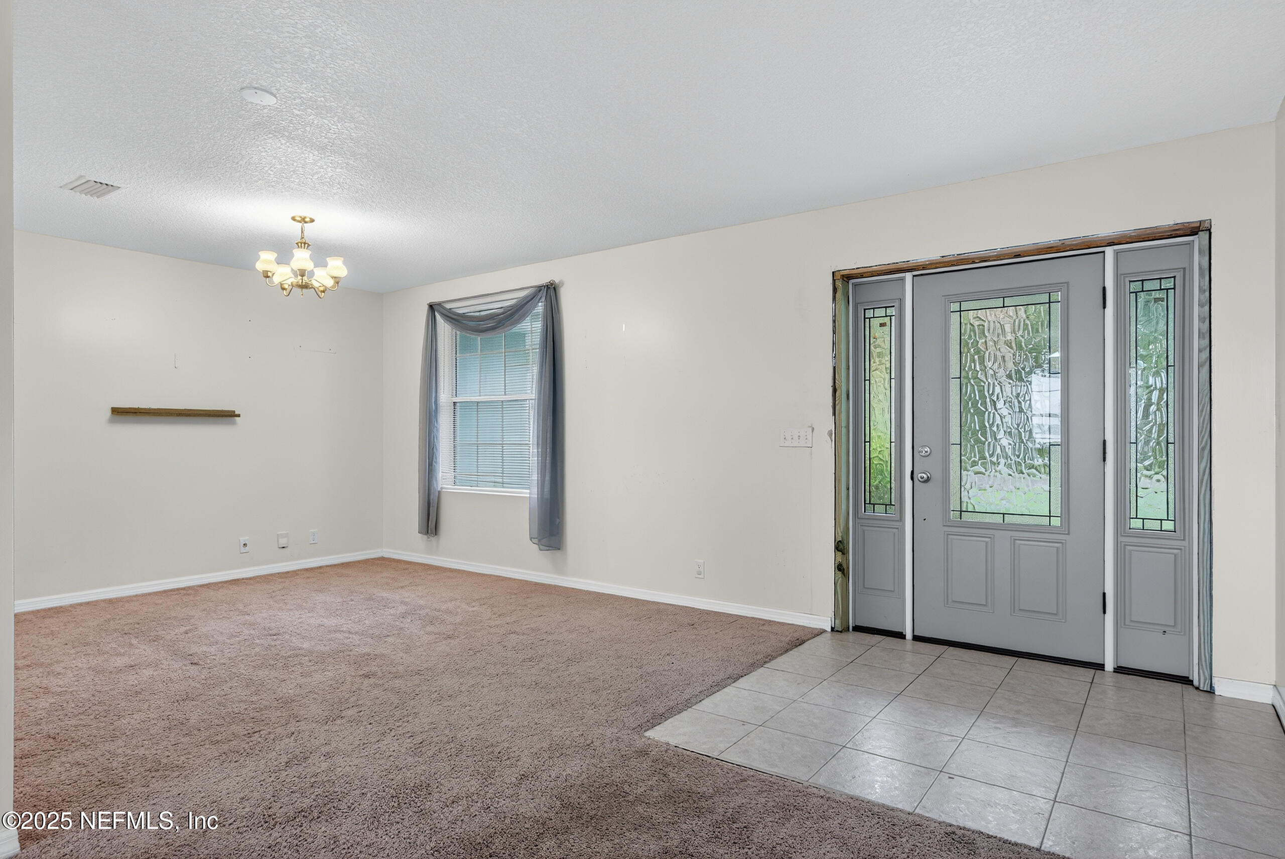 4429 Cedar Road Orange Park, FL 32065 - Photo 17 of 50 an empty room with windows and closet