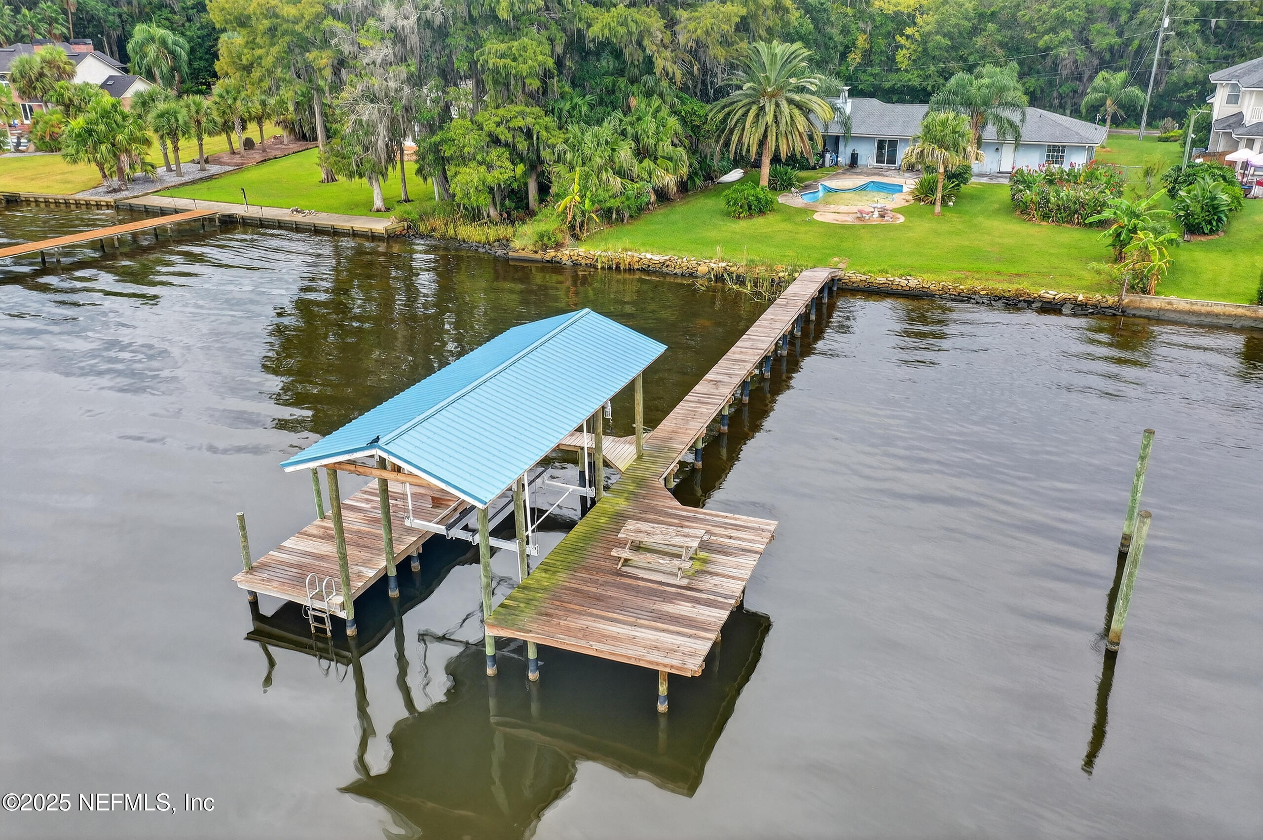 4429 Cedar Road Orange Park, FL 32065 - Photo 2 of 50 a view of a wooden deck and lake view
