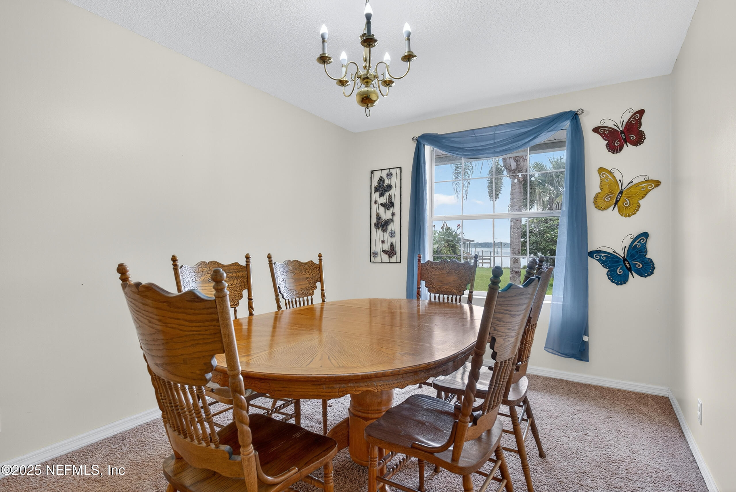 4429 Cedar Road Orange Park, FL 32065 - Photo 22 of 50 a view of a dining room with furniture and chandelier