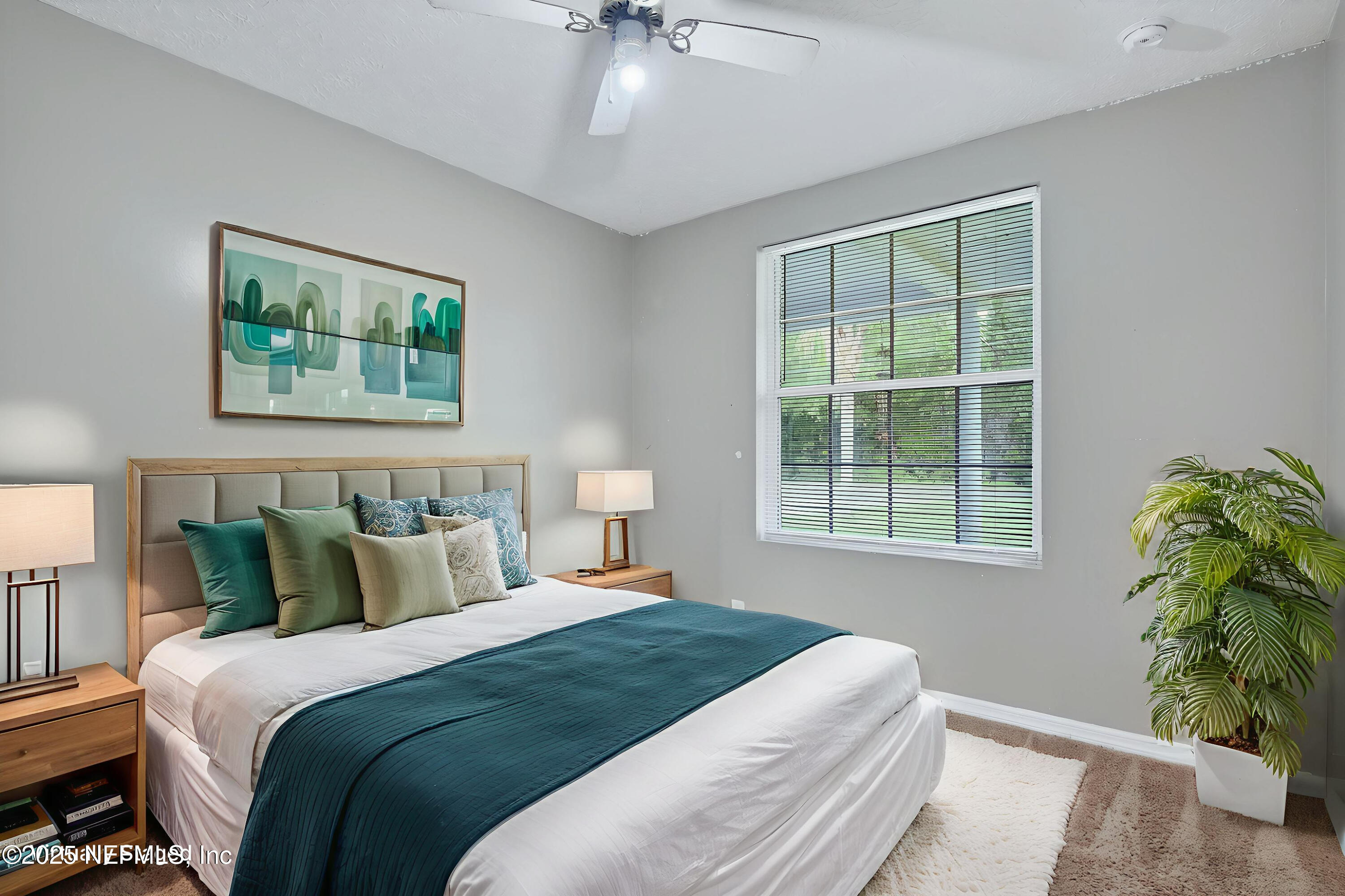 4429 Cedar Road Orange Park, FL 32065 - Photo 27 of 50 a bedroom with bed and a window