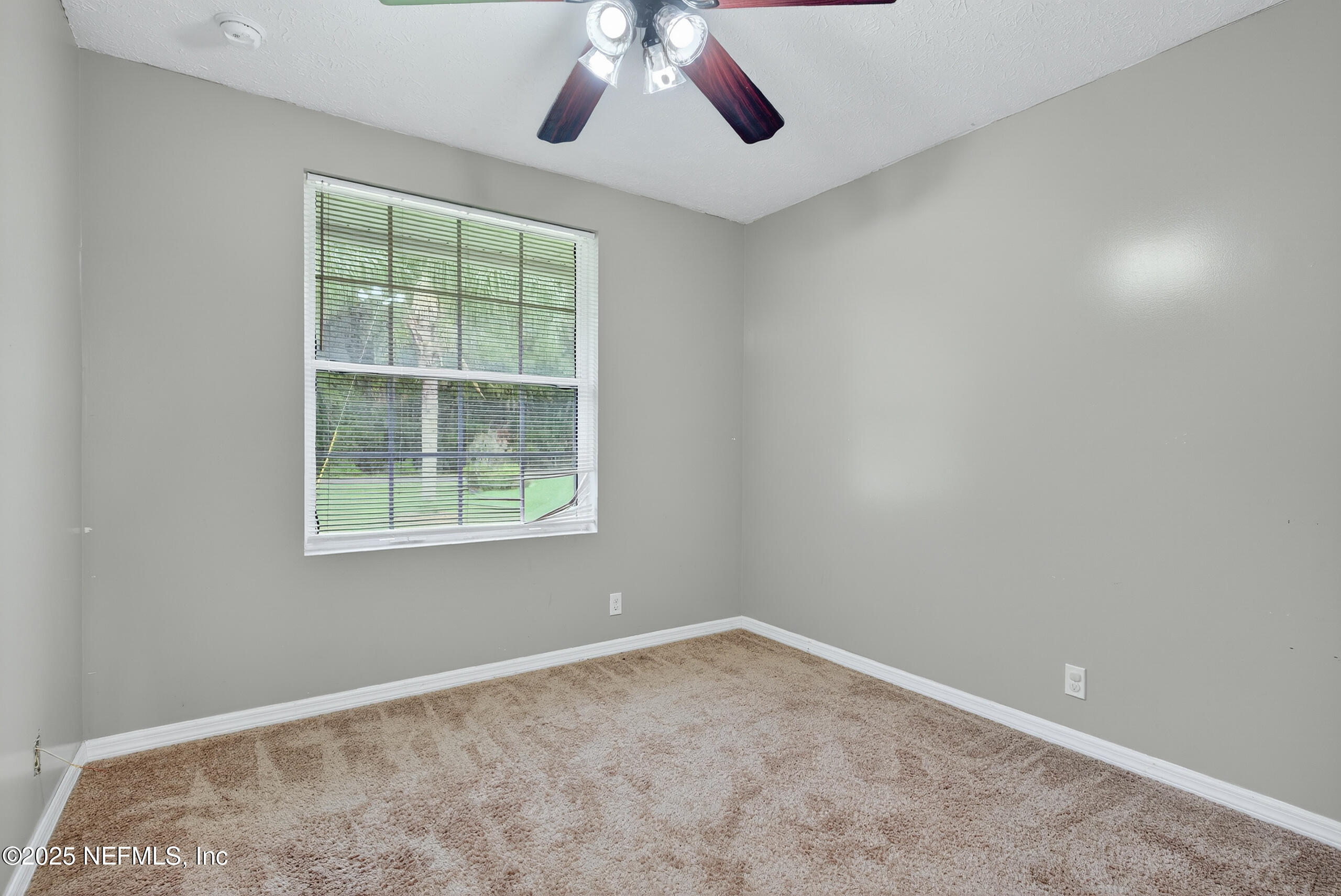 4429 Cedar Road Orange Park, FL 32065 - Photo 28 of 50 an empty room with a window