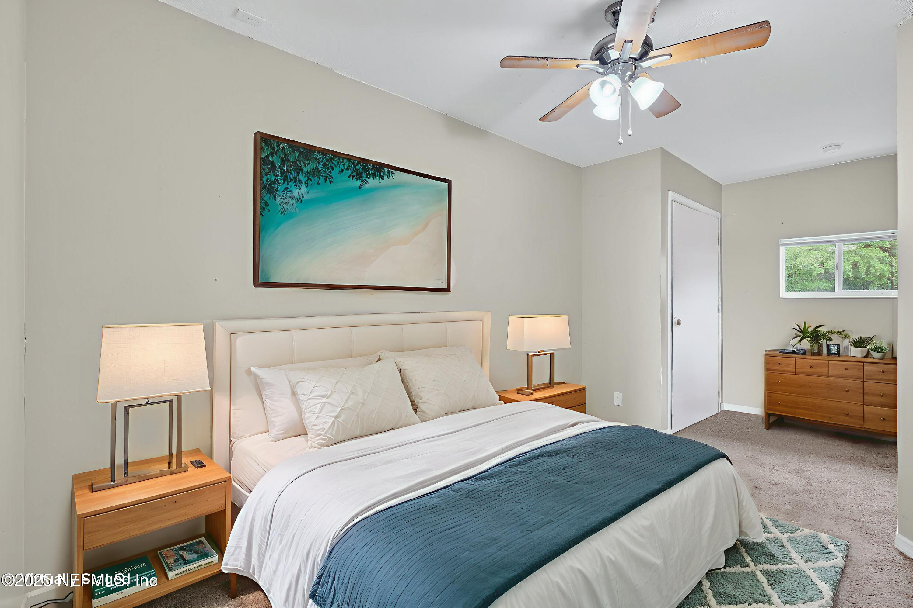 4429 Cedar Road Orange Park, FL 32065 - Photo 29 of 50 a bedroom with a bed and a chandelier