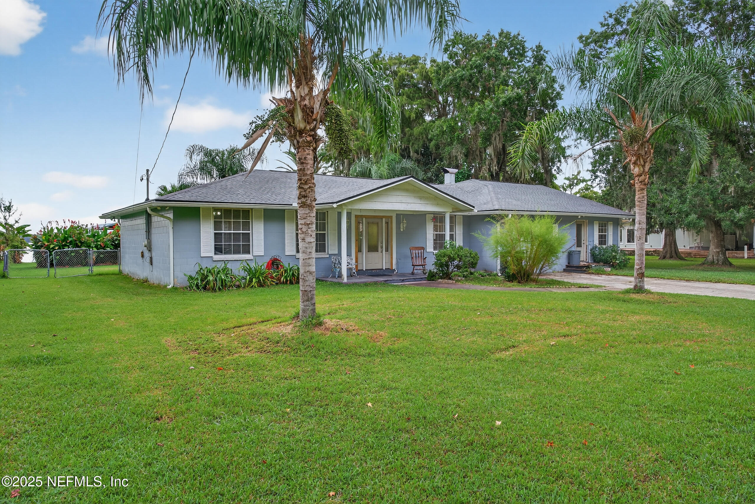 4429 Cedar Road Orange Park, FL 32065 - Photo 47 of 50 a front view of a house with a garden