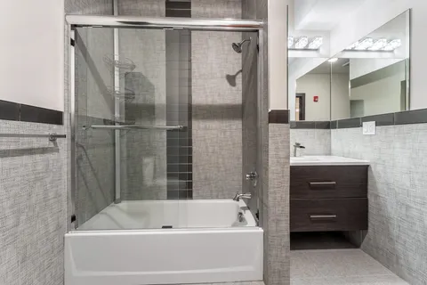 a bathroom with a bathtub and a sink