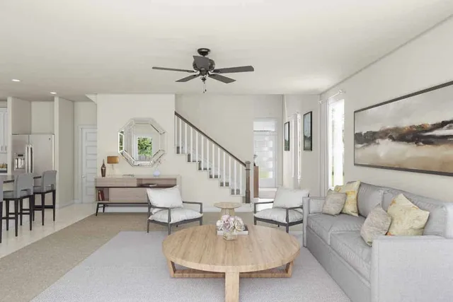 a living room with furniture and a table