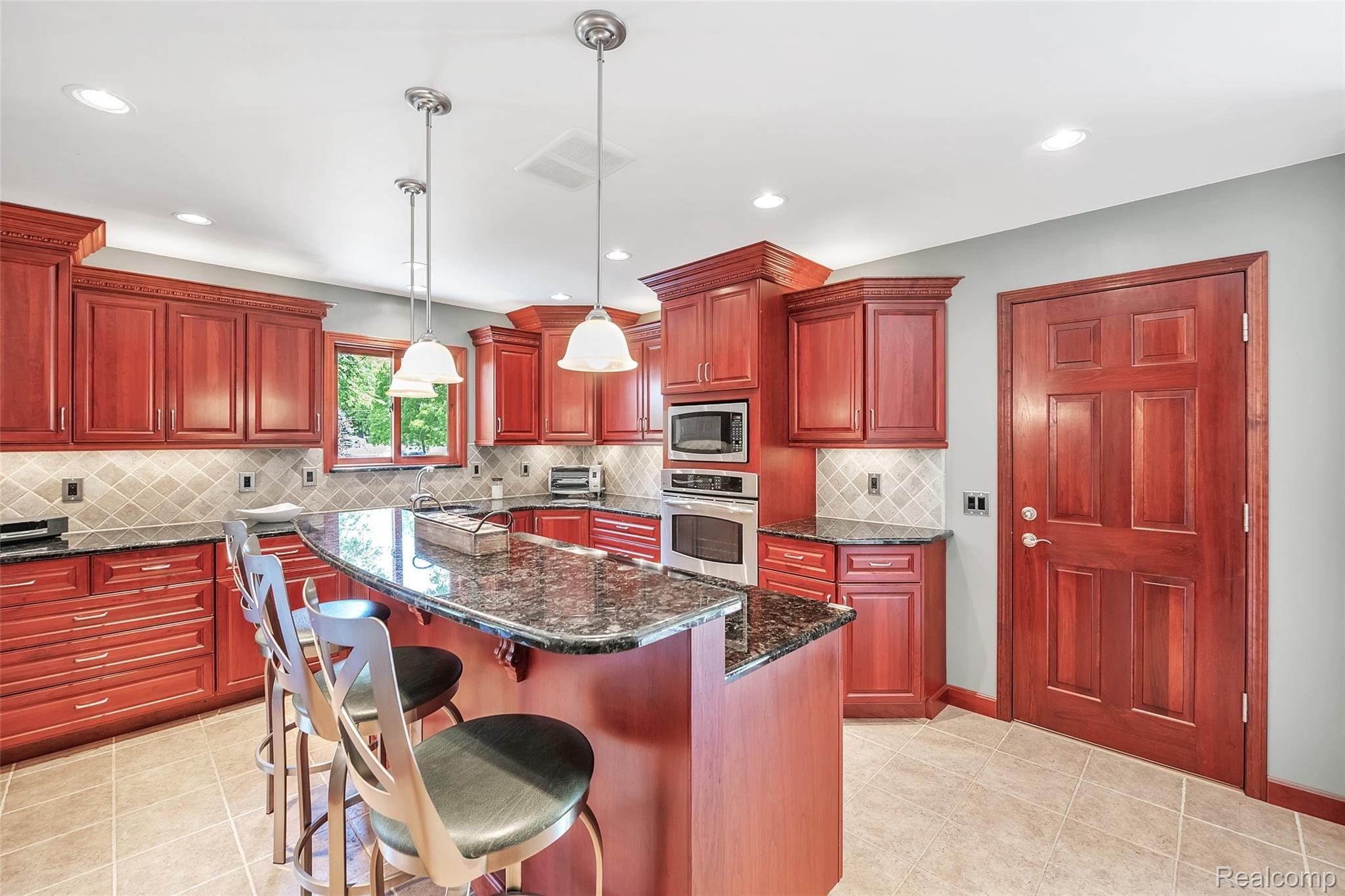 4054 Bennett Lake Road Fenton, MI 48430 - Photo 9 of 57 Center Island is Perfect for Entertaining ~ Granite Countertops