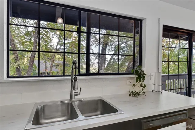 a view of a dining room with a table and chairs