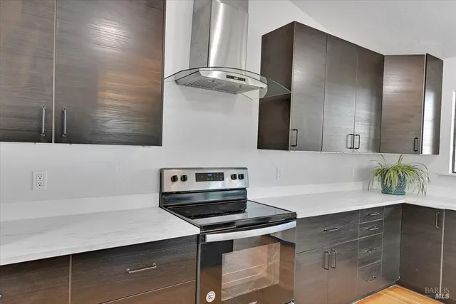 a kitchen with a sink stove and cabinets