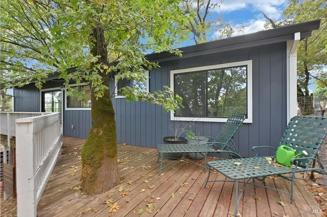 a view of balcony with wooden floor