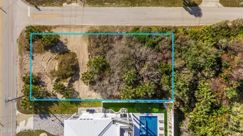 an aerial view of residential building with parking space