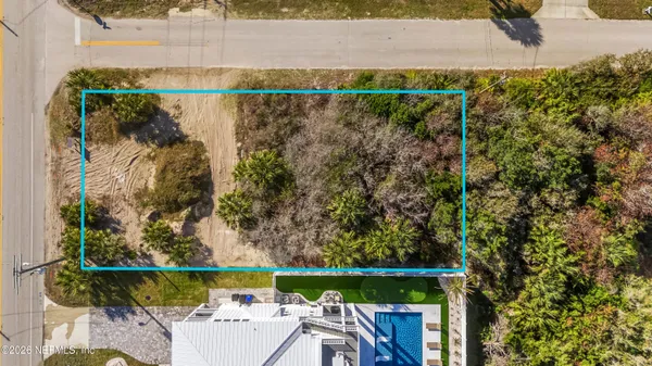 an aerial view of residential building with parking space