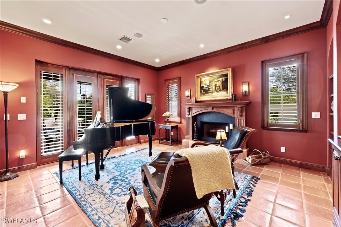 1751 Marlyn Road Fort Myers, FL 33901 - Photo 11 of 49 a living room with fireplace furniture and a flat screen tv