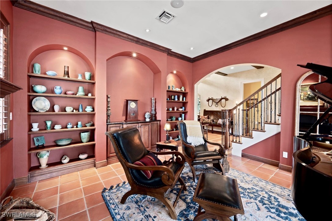 1751 Marlyn Road Fort Myers, FL 33901 - Photo 12 of 49 a view of a livingroom with furniture and staircase