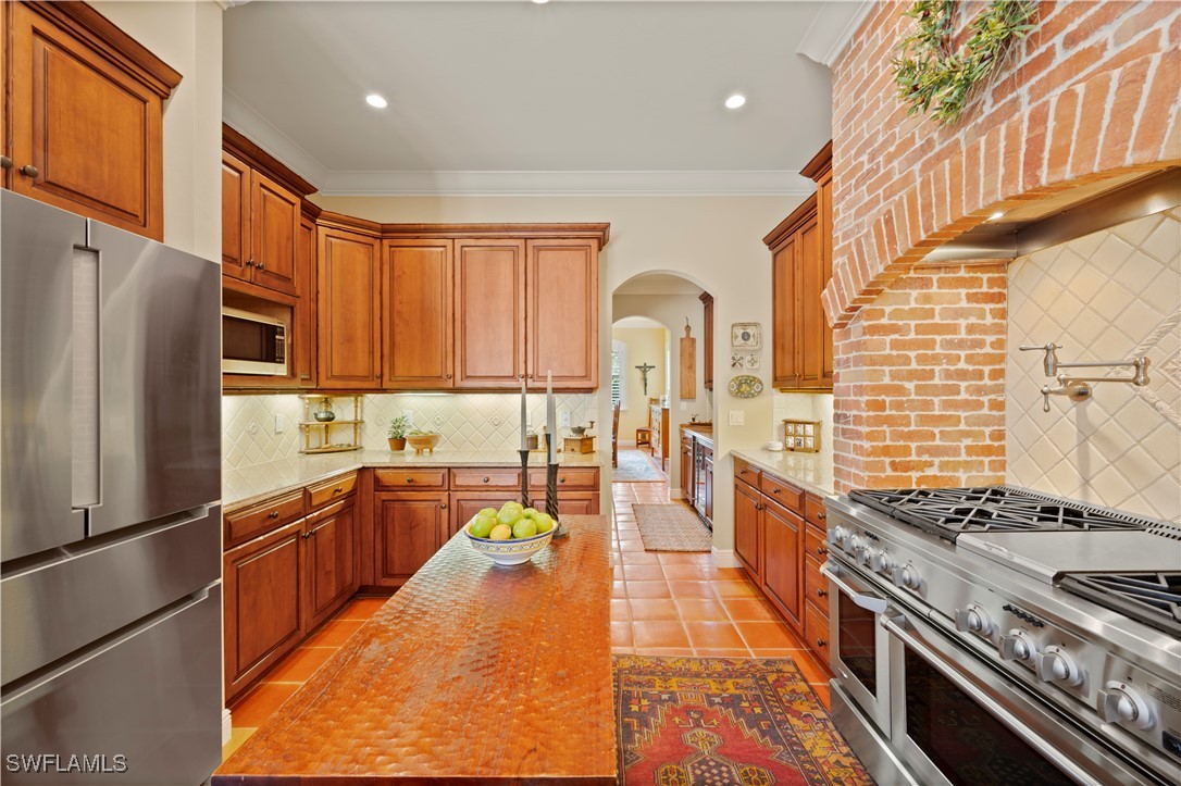 1751 Marlyn Road Fort Myers, FL 33901 - Photo 20 of 49 a kitchen with stainless steel appliances granite countertop a stove a sink dishwasher and a refrigerator