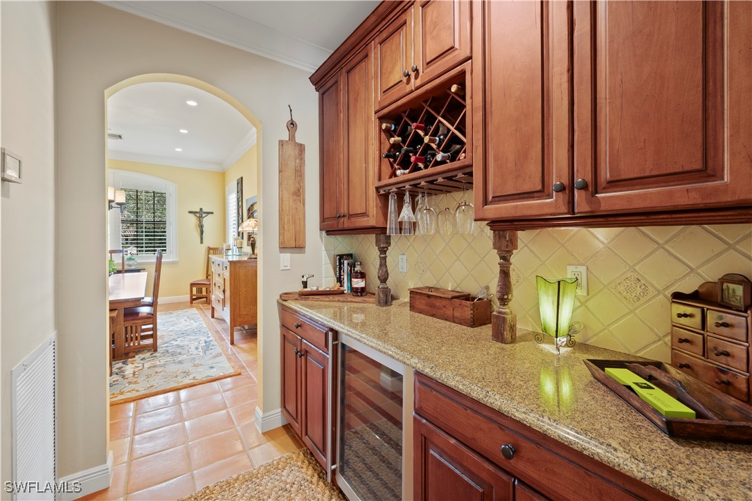 1751 Marlyn Road Fort Myers, FL 33901 - Photo 21 of 49 a kitchen with stainless steel appliances granite countertop a sink a stove and cabinets
