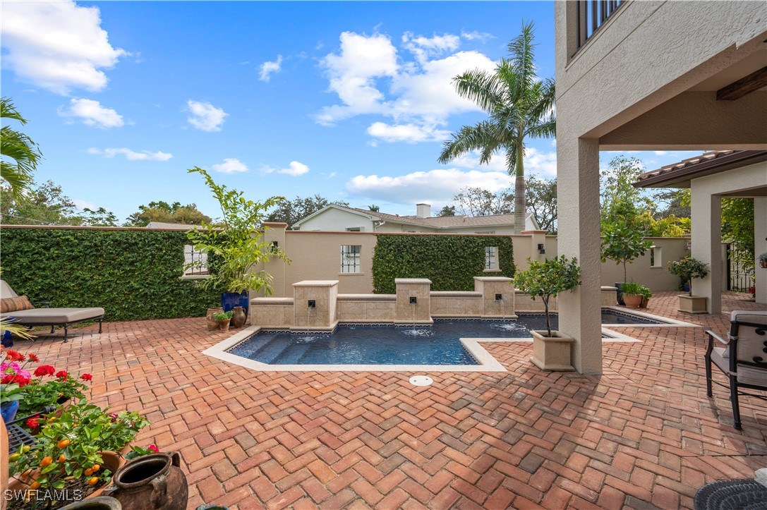 1751 Marlyn Road Fort Myers, FL 33901 - Photo 25 of 49 a view of a house with backyard sitting area and garden