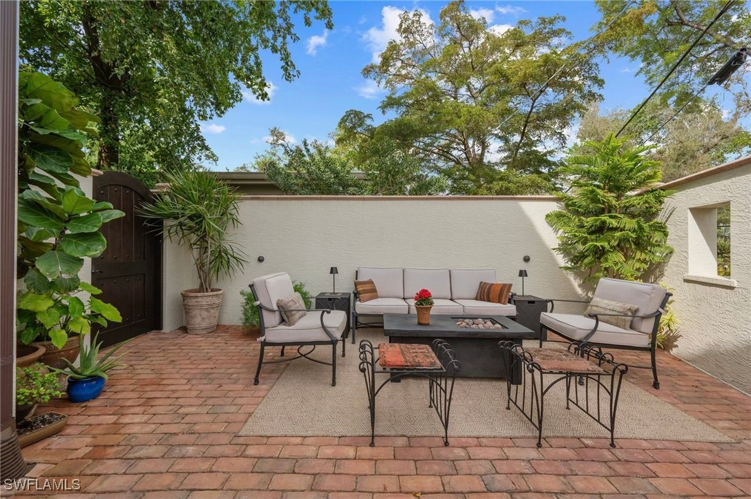 1751 Marlyn Road Fort Myers, FL 33901 - Photo 26 of 49 a backyard of a house with table and chairs