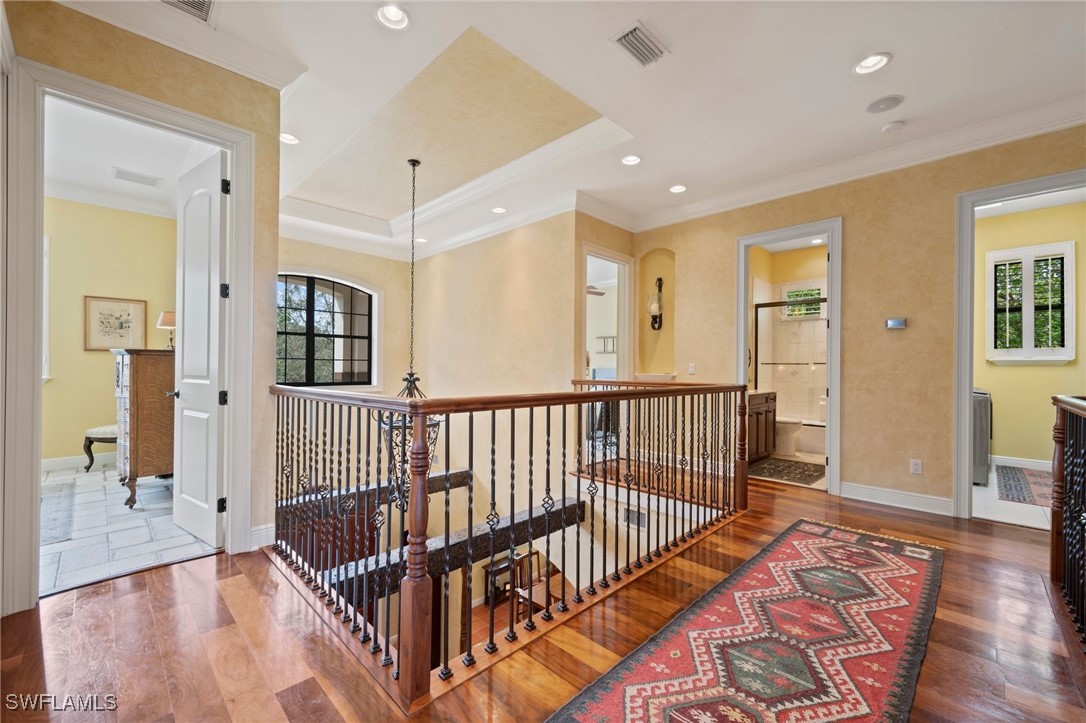 1751 Marlyn Road Fort Myers, FL 33901 - Photo 34 of 49 a view of a hallway with wooden floor and windows