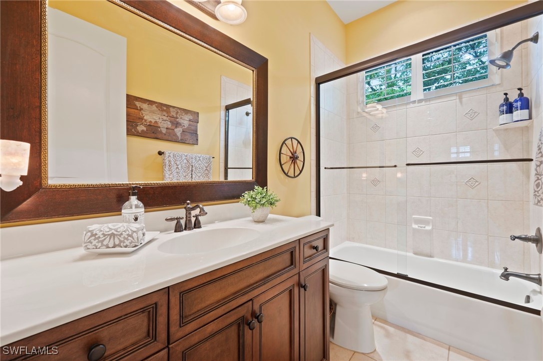1751 Marlyn Road Fort Myers, FL 33901 - Photo 44 of 49 a bathroom with a sink a large mirror and a shower