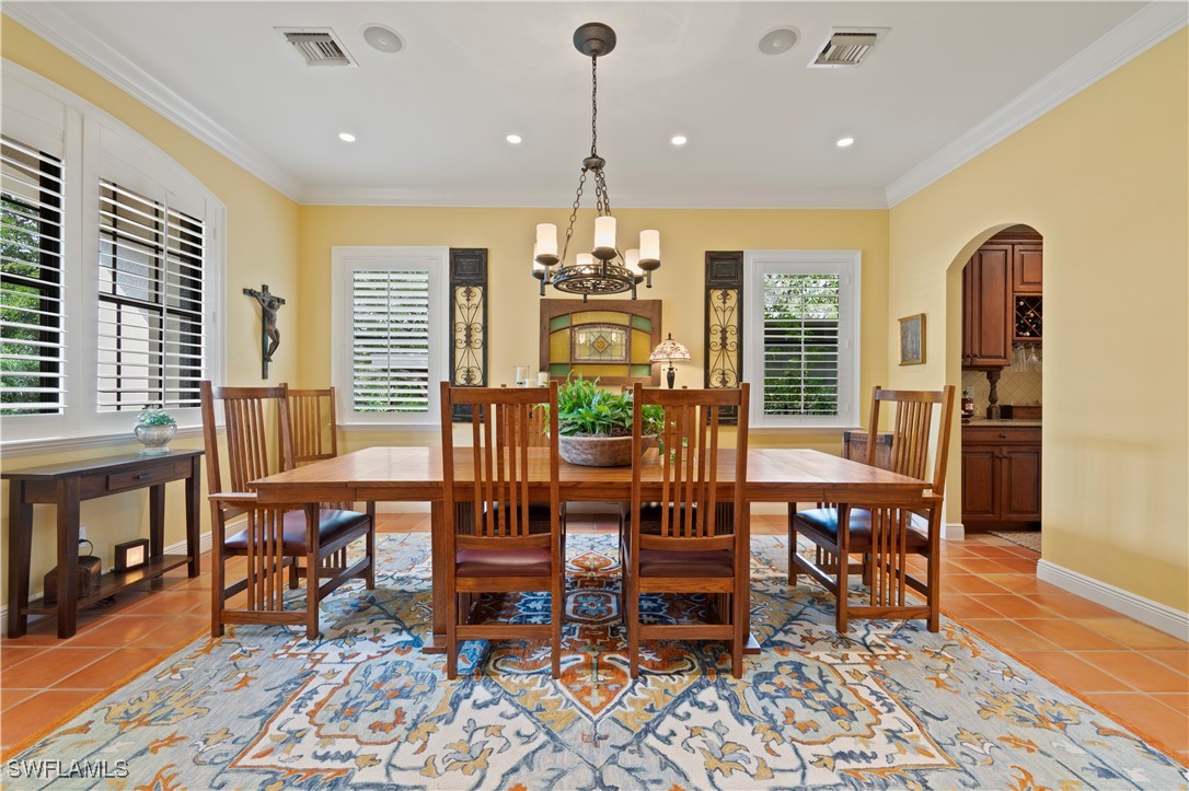 1751 Marlyn Road Fort Myers, FL 33901 - Photo 8 of 49 a view of a dining room with furniture window and wooden floor