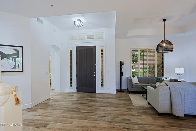 a kitchen with appliances a sink and cabinets