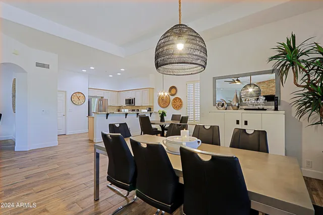 a bedroom with a bed and a television