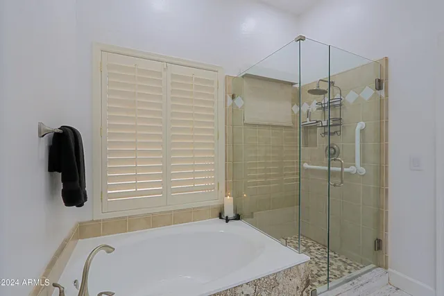 a view of a patio with table and chairs and potted plants
