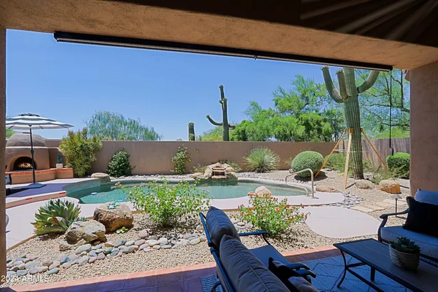 a view of a lake with boats and trees in the background