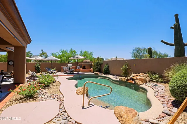 a room with furniture a large window and a sink
