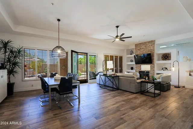 a view of a livingroom with furniture window and wooden floor