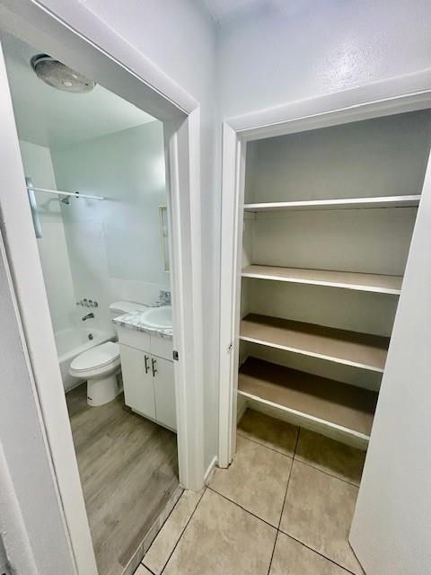 7511 Venetian Street, Unit 8 Miramar, FL 33023 - Photo 11 of 15 a bathroom with a toilet sink and mirror