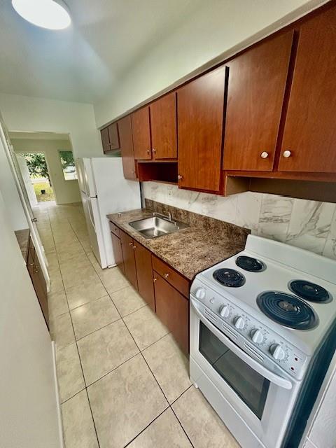 7511 Venetian Street, Unit 8 Miramar, FL 33023 - Photo 6 of 15 a kitchen with a stove and a microwave