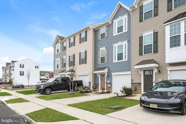 a car parked in front of a brick building